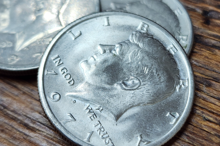 1971 Kennedy Half Dollars in Tampa stacked on one another on wooden background