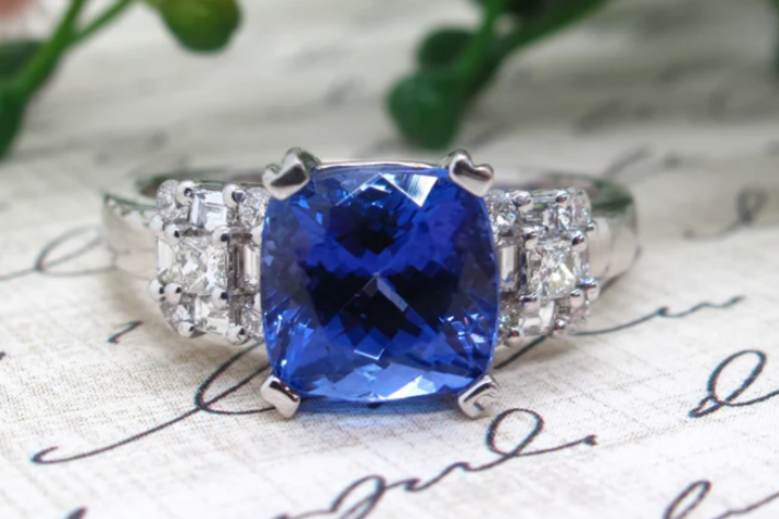 sapphire ring on swirl paper