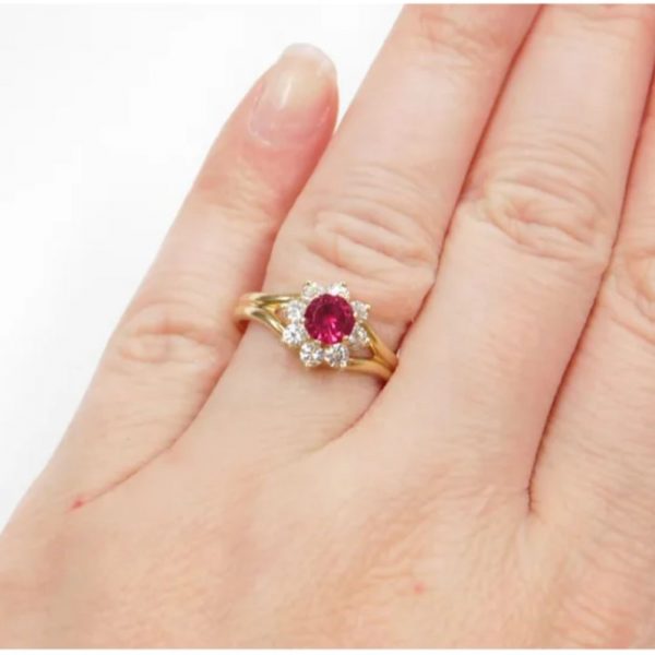 1.13 ctw Created Ruby and Faux Diamond Halo Ring 14k Gold on hand